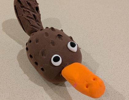 Platypus with brown body and orange beak
